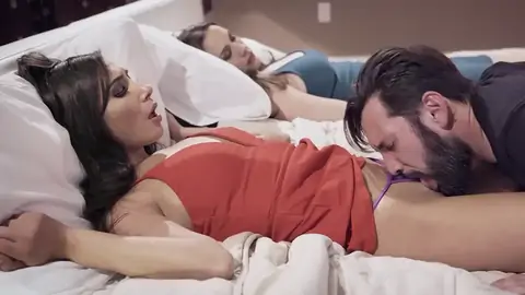 Spouse munching youthful honey's cootchie next to sleeping wifey