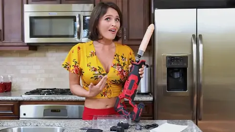 Prepping to smash the dark-haired babe with a machine